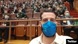 Spanish daily ABC reporter Jaime Santirso is seen in a selfie while covering the second plenary session of China's Legislative Assembly in the Great Hall of the People in Beijing, posted March 7, 2022, to his Twitter @jsantirso.