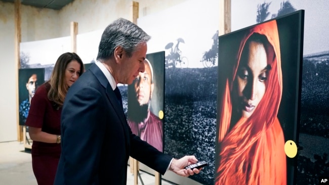 Secretary of State Antony Blinken tours the "Burma's Path To Genocide" exhibit at the United States Holocaust Memorial Museum, Monday, March 21, 2022 in Washington. (Kevin Lamarque, Pool via AP)