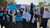 Afghan women and girls take part in a protest in front of the Ministry of Education in Kabul, Afghanistan, March 26, 2022, demanding that secondary schools be reopened for girls. 
