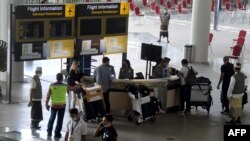 Ruang kedatangan internasional di Bandara Internasional Ngurah Rai, Tuban, dekat Denpasar, Bali, 16 Februari 2022.(SONNY TUMBELAKA / AFP)