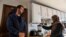 Afghani evacuees Israr, 26, and his wife Sayeda, 23, make a morning smoothie of fruit, nuts and milk, an American concept her and her husband Israr have been trying for a few weeks instead of tea, at their new apartment in Charlestown, Massachusetts on February 21, 2022.