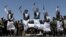 FILE - Houthi supporters perform the traditional Baraa dance during a ceremony held to collect supplies for Houthi fighters, in Sanaa, Yemen, September 22, 2019.