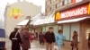 FILE - People walk past Moscow's first McDonalds a day before its opening, in Moscow's Pushkin Square, Jan. 30, 1990. 