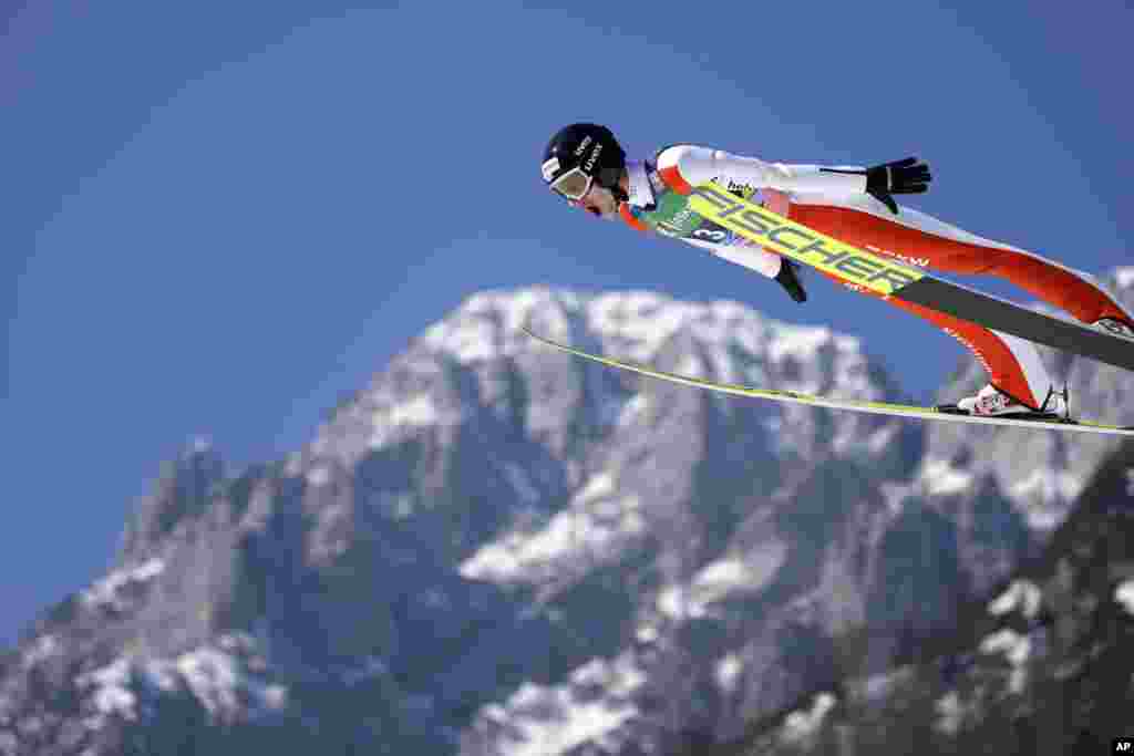 Gregor Deschwanden of Switzerland soars through the air during his first round jump in the Men Flying Hill Individual competition at the FIS Ski Jumping World Cup in Planica, Slovenia.