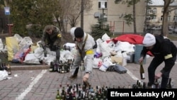 FILE - Civil defense members prepare Molotov cocktails in Kyiv, Ukraine, Feb. 27, 2022. (AP Photo/Efrem Lukatsky, File)