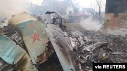 Remains of a Russian military aircraft are seen at a residential area in Chernihiv, Ukraine, in this handout picture released March 5, 2022.