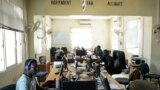 South Sudan's 'Eye Radio' journalists, sit working at their desks in Juba, in the South Sudan capital on March 2, 2019.