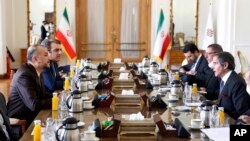 International Atomic Energy Organization, Director General Rafael Mariano Grossi, right, speaks with with Iran's Foreign Minister Hossein Amirabdollahian, left, in Tehran, March 5, 2022. 