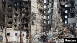 A view shows an apartment building destroyed during Ukraine-Russia conflict in the besieged southern port city of Mariupol, Ukraine on March 30, 2022.