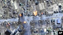 This satellite image provided by Maxar Technologies shows burning buildings in a residential area in northeast Chernihiv, Ukraine, on March 16, 2022.