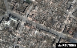 A satellite image shows destruction of homes and buildings, in Mariupol, Ukraine, March 29, 2022. Courtesy Maxar Technologies.