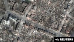 FILE - A satellite image shows destruction of homes and buildings, in Mariupol, Ukraine, March 29, 2022. Courtesy Maxar Technologies.