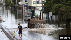 FILE - A view of a flooded road following heavy rains in Lismore, New South Wales, Australia March 2, 2022. 