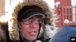 Musher Brent Sass speaks to reporters in this 2012 file photo. Sass is maintaining his lead in the Iditarod Trail Sled Dog Race and was the first to arrive at the checkpoint in Kaltag, early Saturday, March 12, 2022.