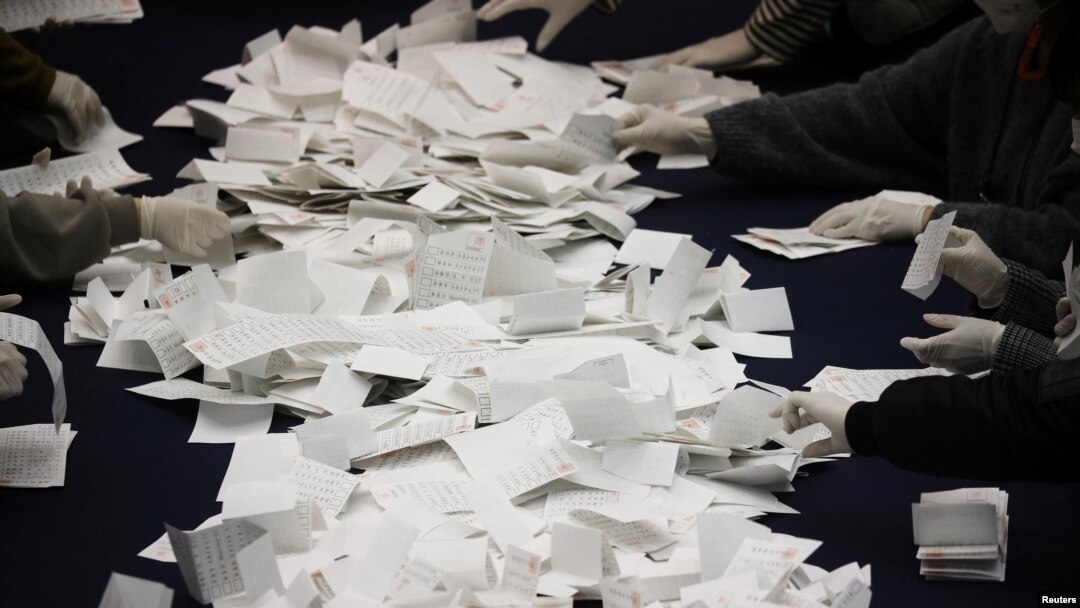 National Election Commission officials count ballots for the presidential election in Seoul, South Korea, March 9, 2022. 
