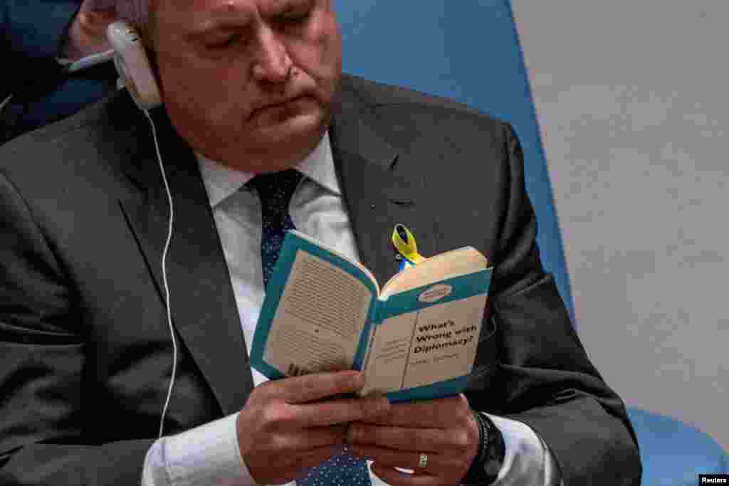 Ukrainian Ambassador to the U.N. Sergiy Kyslytsya reads a book named &quot;What&rsquo;s Wrong with Diplomacy?&quot; as Russian Ambassador to the U.N. Vasily Nebenzya speaks to the United Nations Security Council, at the United Nations&nbsp;Headquarters in New York, March 29, 2022.