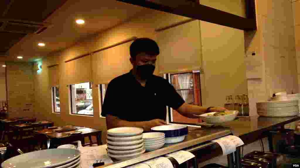 Table &amp; Apron reduced seating and stopped serving lunch on weekdays because the restaurant is 25% understaffed. (David Grunebaum/VOA)