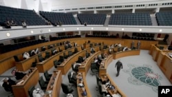 FILE - Lawmakers attend a session of Kuwait's National Assembly, in Kuwait City, Feb. 8, 2022. Kuwait's government resigned on April 5, 2022, just months after its formation, opening up new uncertainty as the tiny country grapples with a worsening political crisis.