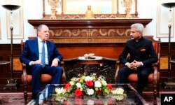 In this photo provided by Indian Foreign Minister S. Jaishankar's Twitter handle, Jaishankar and his Russian counterpart Sergei Lavrov sit for a meeting in New Delhi, India, April 1, 2022.