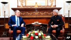 In this photo provided by Indian Foreign Minister S. Jaishankar's Twitter handle, Jaishankar and his Russian counterpart Sergei Lavrov sit for a meeting in New Delhi, India, April 1, 2022. 