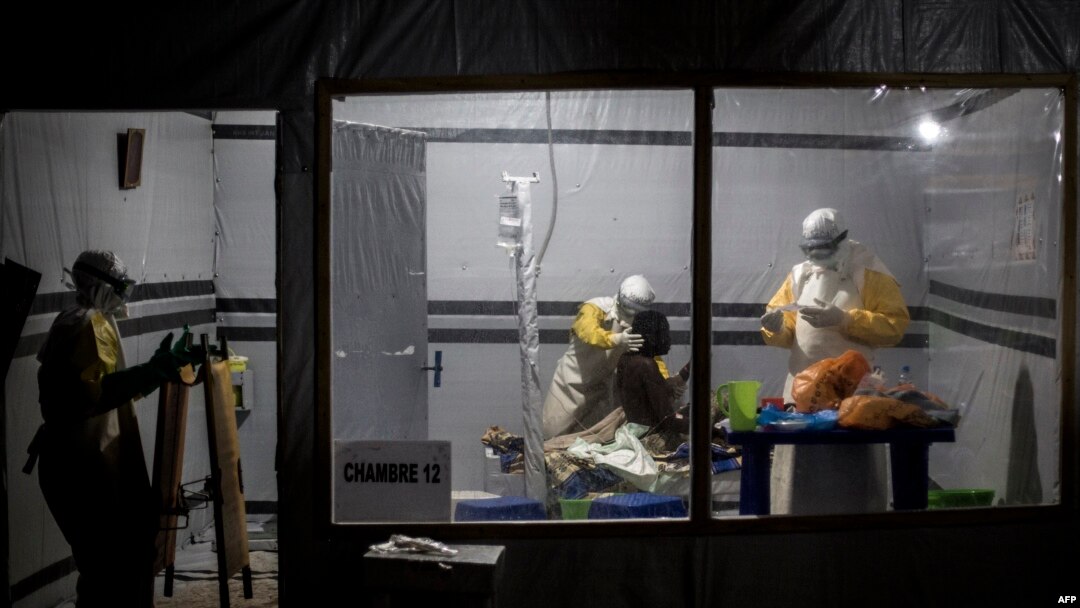 FILE - Health workers treat an unconfirmed Ebola patient, inside a MSF (Doctors Without Borders) supported Ebola Treatment Centre (ETC), Nov. 3, 2018 in Butembo, Democratic Republic of the Congo.
