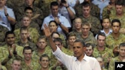 U.S. President Barack Obama waves to the troops after speaking at the Royal Army Air Force Base in Darwin, Australia, November 17, 2011.