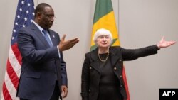 U.S. Treasury Secretary Janet Yellen, right, greets President of Senegal Macky Sall prior to a meeting during the US - Africa Leaders Summit at the Walter E. Washington Convention Center in Washington, Dec. 15, 2022.