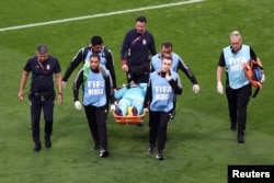 Iran's Alireza Beiranvand is carried away on a stretcher after sustaining an injury in the match against England in the FIFA World Cup Qatar 2022 at Khalifa International Stadium, Nov. 21, 2022.