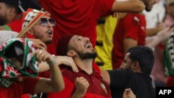 Morocco's fans celebrate after the Qatar 2022 World Cup Group F football match between Belgium and Morocco at the Al-Thumama Stadium in Doha on November 27, 2022.