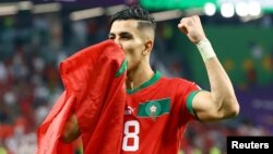 Morocco's Jawad El Yamiq celebrates qualifying for the quarterfinals at the 2022 FIFA World Cup