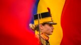 A honor guard soldier stands at attention during a memorial religious service for those killed in the 1989 uprising in Bucharest, Romania. 