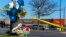 Flowers and balloons sit near the scene of a mass shooting at a Walmart, Nov. 23, 2022, in Chesapeake, Va. A Walmart manager opened fire on fellow employees in a break room of the Virginia store the night before.