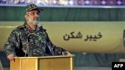 FILE - In a photo made available Feb. 9, 2022, on the official website of the Iranian Revolutionary Guard Corps Sepahnews shows Gen. Amir Ali Hajizadeh, commander of the aerospace division of the Iran's Revolutionary Guard, speaking at a podium at an undisclosed location in Iran.