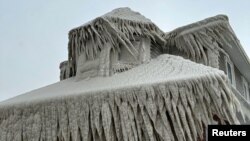 Hoak's restaurant is covered in ice from the spray of Lake Erie waves during a winter storm that hit the Buffalo region, in Hamburg, New York, Dec. 24, 2022. 