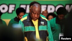 South African President Cyril Ramaphosa bows his head during a prayer service at the start of the 55th National Conference of the ruling African National Congress (ANC) at the Nasrec Expo Centre in Johannesburg, South Africa, December 16, 2022. 