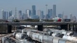 FILE - The Houston, Texas, skyline is seen from a railroad yard on March 6, 2019. 