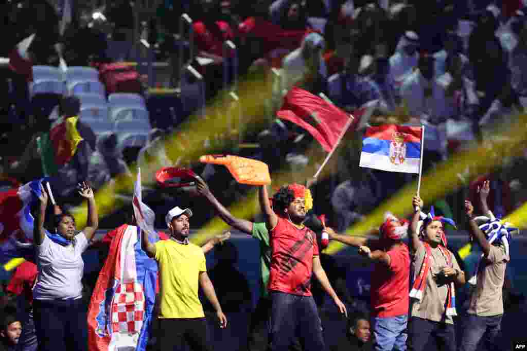 Dancers wave flags of the World Cup teams as they perform during the opening ceremony ahead of the Qatar 2022 World Cup Group A football match between Qatar and Ecuador.&nbsp; &nbsp;