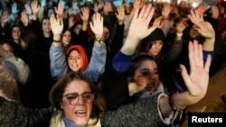 FILE - Women protest against a Spanish court which sentenced five of six men accused of gang-raping a 14-year-old girl to 10 to 12 years in prison for sexually abusing the minor, but acquitted them of rape, outside the Justice Ministry in Madrid. 