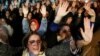 FILE - Women protest against a Spanish court which sentenced five of six men accused of gang-raping a 14-year-old girl to 10 to 12 years in prison for sexually abusing the minor, but acquitted them of rape, outside the Justice Ministry in Madrid, Spain, N