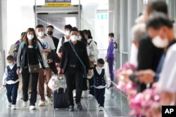 Chinese tourists arrive at Suvarnabhumi International Airport in Samut Prakarn province, Thailand, Jan. 9, 2023.