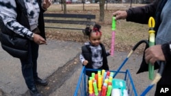 When Holifield and her daughter had COVID-19 in May, the toddler had to miss 15 days of child care. (AP Photo/Erin Hooley)