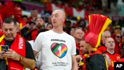 A soccer fan wears a rainbow shirt at the World Cup soccer match between Belgium and Canada, at the Ahmad Bin Ali Stadium in Doha, Qatar, Nov. 23, 2022.