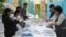 Election commission members count ballots at a polling station in Almaty, Kazakhstan, Nov. 20, 2022. 