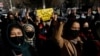 FILE - Afghan women chant slogans in protest against the closure of universities to women by the Taliban in Kabul, Dec. 22, 2022. 