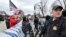 FILE - A U.S. Supreme Court police officer stands on alert in Washington on Jan. 6, 2021.