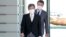 FILE - Minister of Internal Affairs Minoru Terada arrives at the prime minister's office in Tokyo, Japan, Aug. 10, 2022. 
