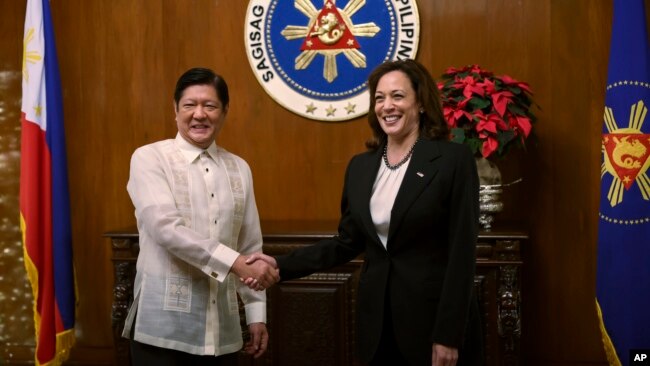 U.S. Vice President Kamala Harris, right, shakes hands with Philippine President Ferdinand Marcos Jr. at the Malacanang presidential palace in Manila, Philippines, Nov. 21, 2022.