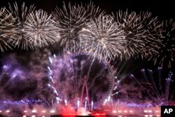 Fireworks light-up the sky over the London Eye in central London to celebrate the New Year, Jan. 1, 2023.