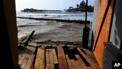 A destroyed deck is seen at the Capitola Esplanade between Zelda's by the Beach and My Thai Beach in Capitola, Cali., on Jan. 12, 2023.