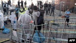 A migrant leaves the Ocean Viking in Toulon, France, on Nov. 11, 2022, after being rescued by a European maritime-humanitarian organization.